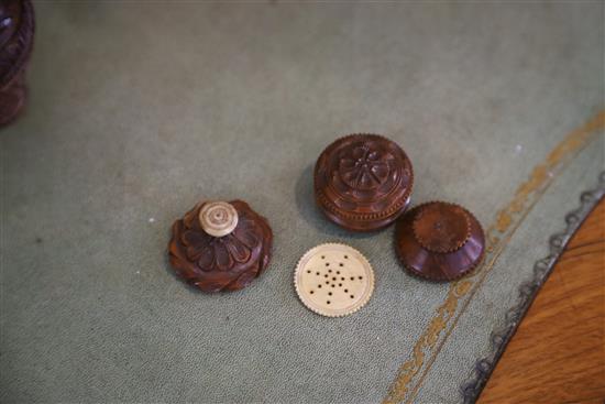 Five 19th century coquilla nut nutmeg graters and two condiment shakers, largest 7.2cm